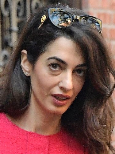 Amal Clooney with minimal makeup and carefree waves